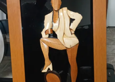 A framed picture of a woman with a tennis racket.