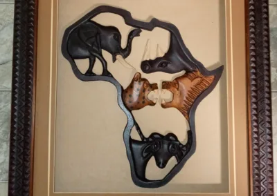 A wooden frame with african animals in it.