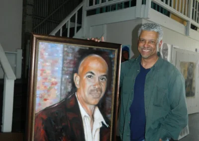 A man holding a painting.